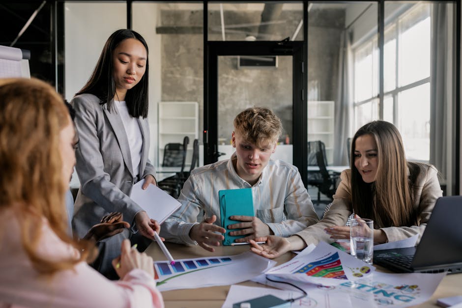 A diverse group of colleagues having a lively discussion around a conference table in a modern office